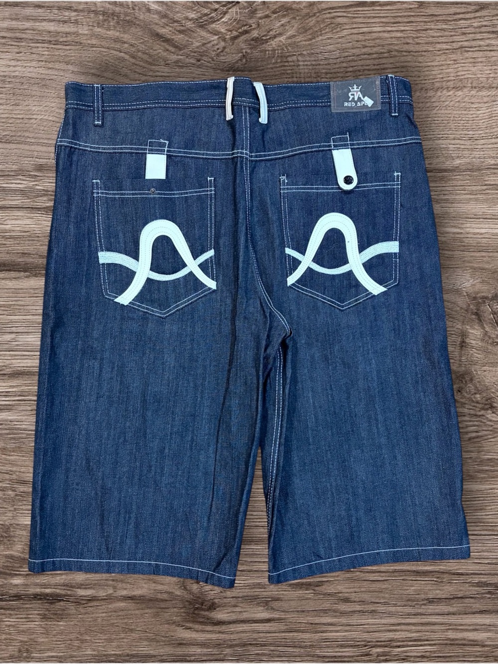 Men’s red ape shorts 42” ( missing button )